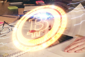 Double exposure of man's hands holding and using a phone and crypto currency blockchain theme drawing.