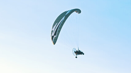 Paramotor Tandem Gliding And Flying In The Air. Copy space. High quality photo