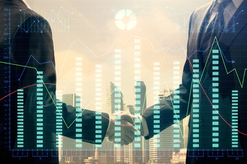 Double exposure of forex graph hologram and handshake of two men. Stock market concept.