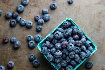 Fresh blueberries on a dark surface