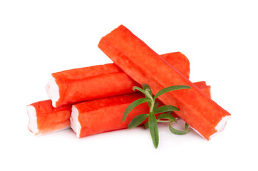 Crab stick isolated on white background. Imitation crab meat with rosemary sprig. Fish product. © vandycandy