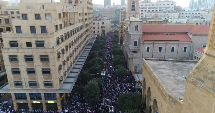 Beirut, Lebanon 2019 : day drone shot from road coming from Riad El Solh square to Martyr square with thousands of protesters revolting against government corruption during the Lebanese revolution