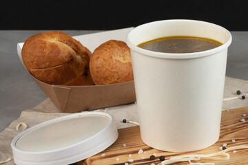 Eco packaging - soup in a craft glass for soup for a delivery service. Vegan food.