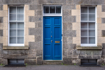 Fototapeta na wymiar Blue door of tenement in Edinburgh city, UK