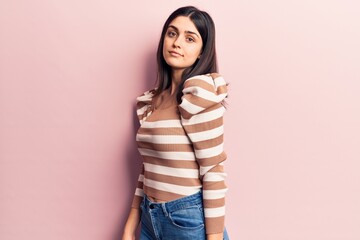 Young beautiful girl wearing casual clothes standing over isolated pink background