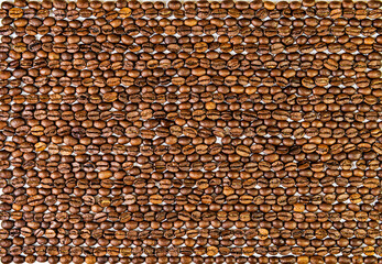 Roasted coffee beans in even lines texture