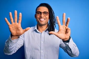 Young handsome african american man with dreadlocks wearing casual shirt and glasses showing and...