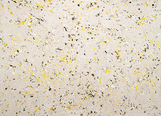 Textured paint floor with transitions of yellow and black color pieces and shades. Background of yellow and black colors that are aged in the form of a dot brush and blended into each other in the for