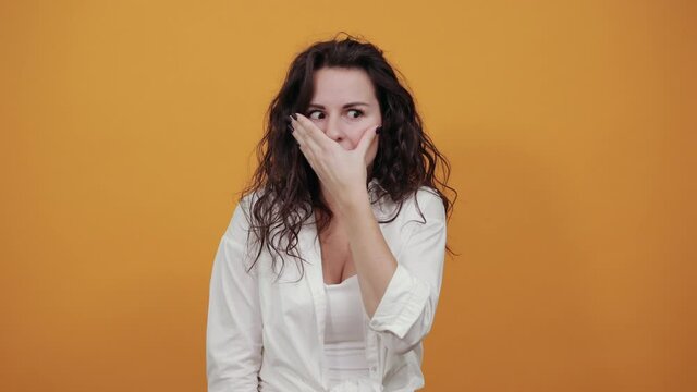 Covering her mouth with palm. Can't say anything. Shocked gasping amazed hearing stunning unbelievable news press palm mouth astonished gossiping found out shocking truth, stunned speechless