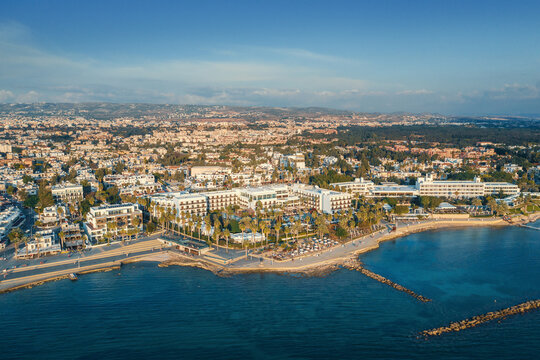 Aerial view of Paphos embankment in Cyprus. Coastline with hotels, cafes, restaurants and walking area, view from above.