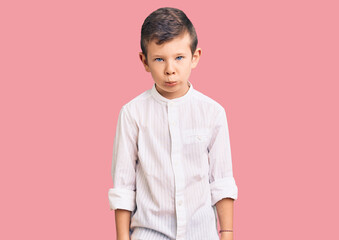 Cute blond kid wearing elegant shirt depressed and worry for distress, crying angry and afraid. sad expression.