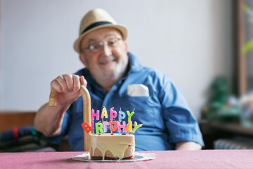 old man celebrating his birthday