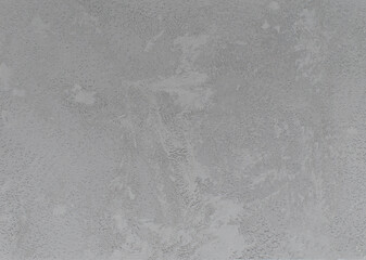 Gray background or texture. Texture of white gray wall. Abstract brush and gray textured wall plaster with a blow texture. Decorative textured paint.