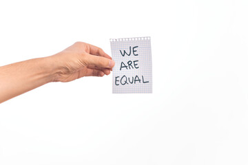 Cardboard banner WE ARE EQUAL, protesting for equal rights over isolated white background