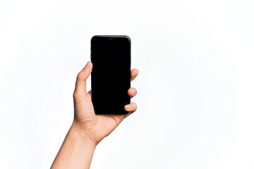 Hand of caucasian young man holding smartphone showing screen over isolated white background