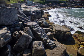 Lonely staircase with the sea in the background
