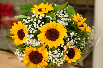 Sunflower buquet with straw close up
