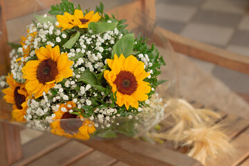 Sunflower buquet with straw close up
