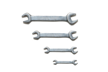 Fixed wrenches lined up on white background