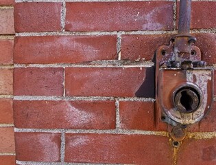 Awning crank on and abandoned brick building 