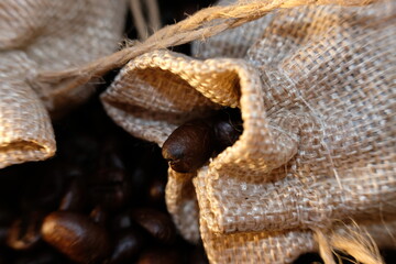close up coffee beans and macro coffee beans on wood table background