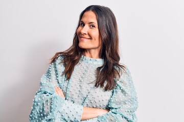 Young beautiful brunette woman wearing casual t-shirt standing over isolated white background happy face smiling with crossed arms looking at the camera. Positive person.