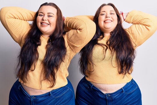 Young plus size twins wearing casual clothes relaxing and stretching, arms and hands behind head and neck smiling happy