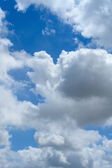 beautiful blue sky with white clouds in a morning vertical composition