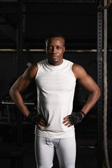 Obraz na płótnie Canvas african american athletics man posing in gym and fitness club