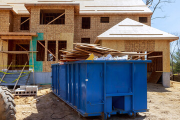 Truck loading a full recycling container trash dumpsters being full with garbage container trash