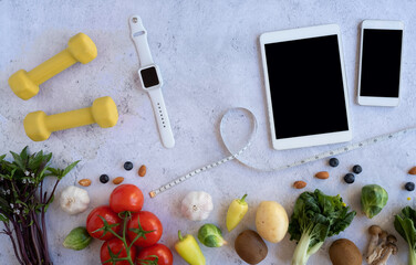 nutrition on mobile phone for diet food  and meal. flat lay of  healthy vegetable . 