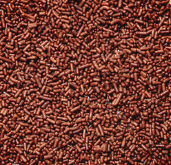 Chocolate granulado ( chocolate sprinkles ) em fotografia macro em tela inteira.