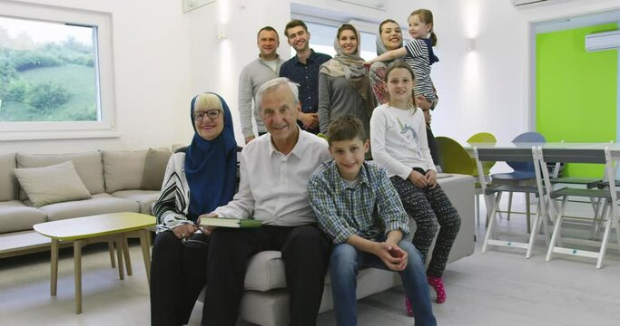 portrait of happy modern muslim family before iftar dinner during ramadan feast at home