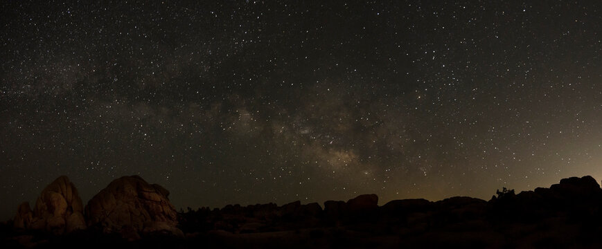 Panorama of milky way above Joshua Tree Park