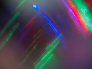 Bright colored lights reflecting off metal and softly focused.