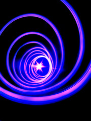 Abstract glowing light swirls with a black background. part of a colour collection, made with natural light.