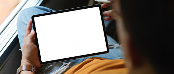 Male freelancer resting with mock-up tablet while lying relaxed on office chair © bongkarn