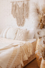 Bright boho style bedroom with macrame decor.