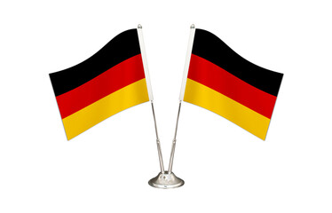 Germany table flag isolated on white ground. Two flag poles with flags and Germany flag on the table.