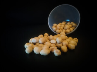 pile of spilled beans isolated on black background