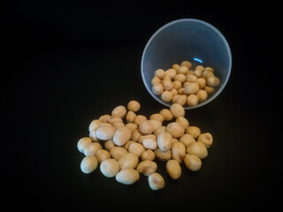 pile of spilled beans isolated on black background