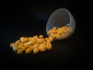 pile of spilled beans isolated on black background