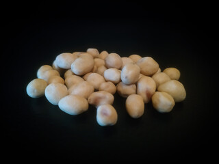 pile of spilled beans isolated on black background