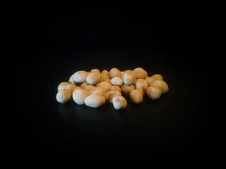 pile of spilled beans isolated on black background