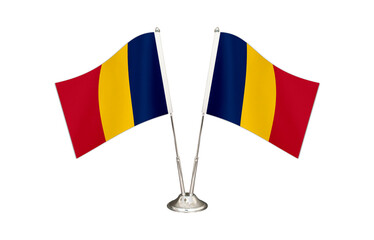 Chad table flag isolated on white ground. Two flag poles with flags and Chad flag on the table.