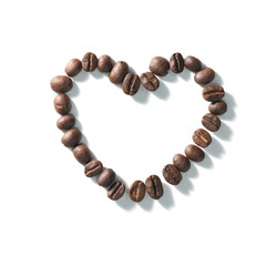 Love sign with coffee beans arranged Heart shape over white background.
