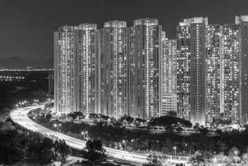 High rise residential building and highway in Hong Kong city at night