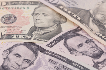 Obraz na płótnie Canvas The texture of US dollars. Background from dollar bills.