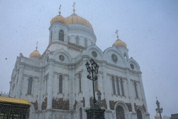 Famous orthodox Cathedral Of Christ the Savior in a snow storm with snow flakes in the air in Moscow, Russia