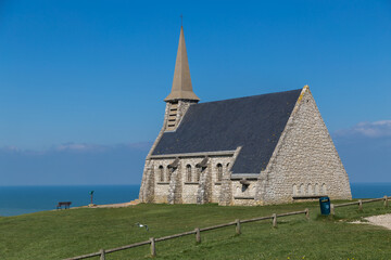 Fototapeta na wymiar Chapelle Notre-Dame-de-la-Garde on a cliff in Etretat, Normandy, France